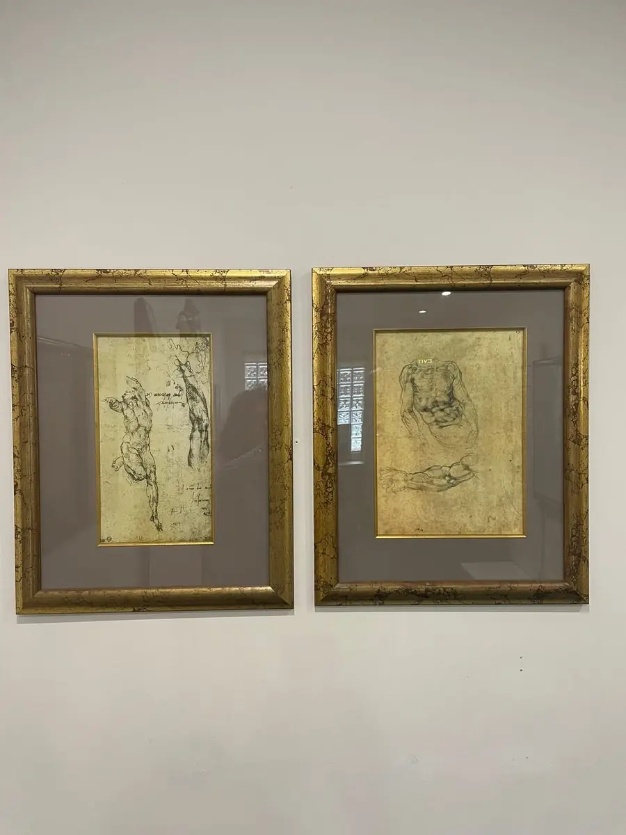A pair of framed figure studies in the Renaissance master-drawing style, one with Hebrew lettering, matted in charcoal grey with gilt frames