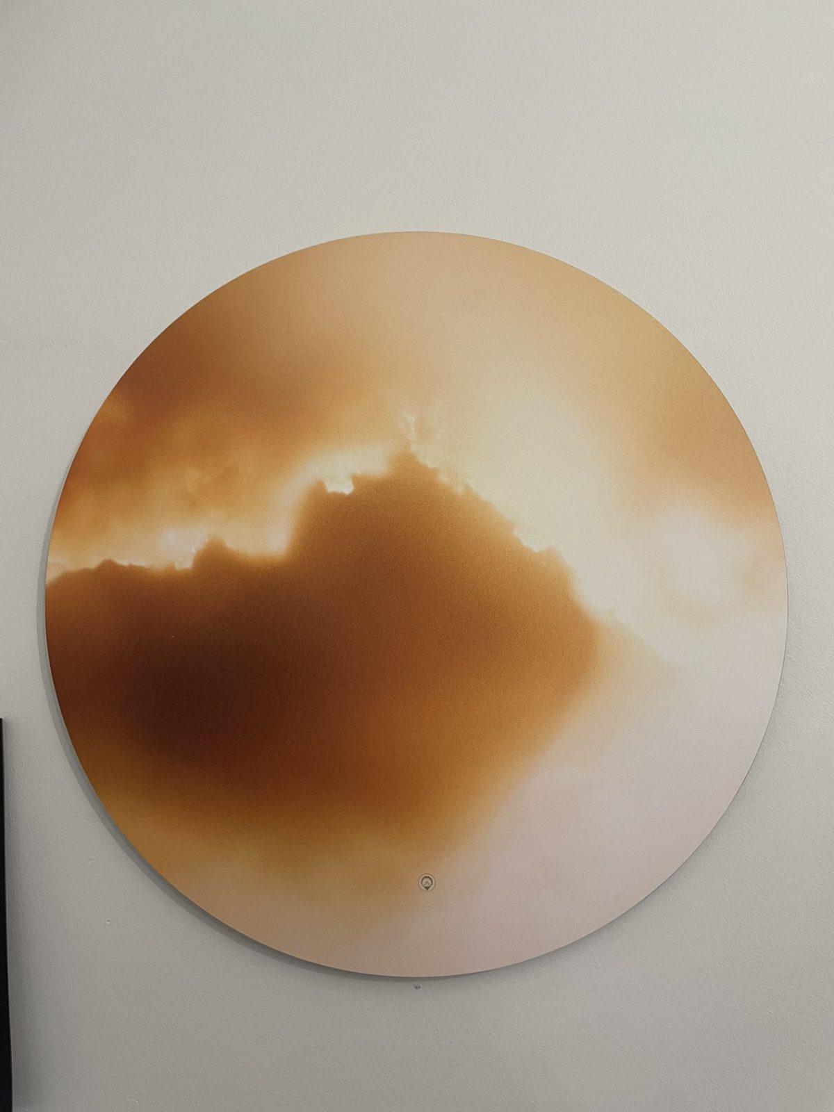 A circular Keys to Awaken Resonance Art work, a soft amber cloud on cream