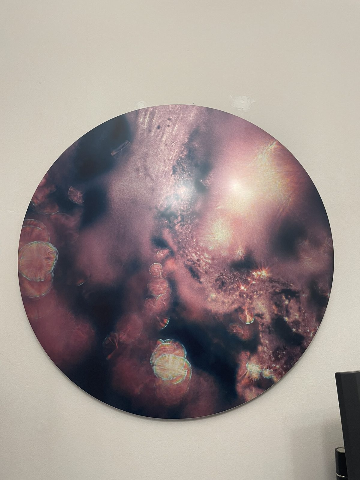 A circular Keys to Awaken Resonance Art work in coral and dusk tones, with luminous spheres