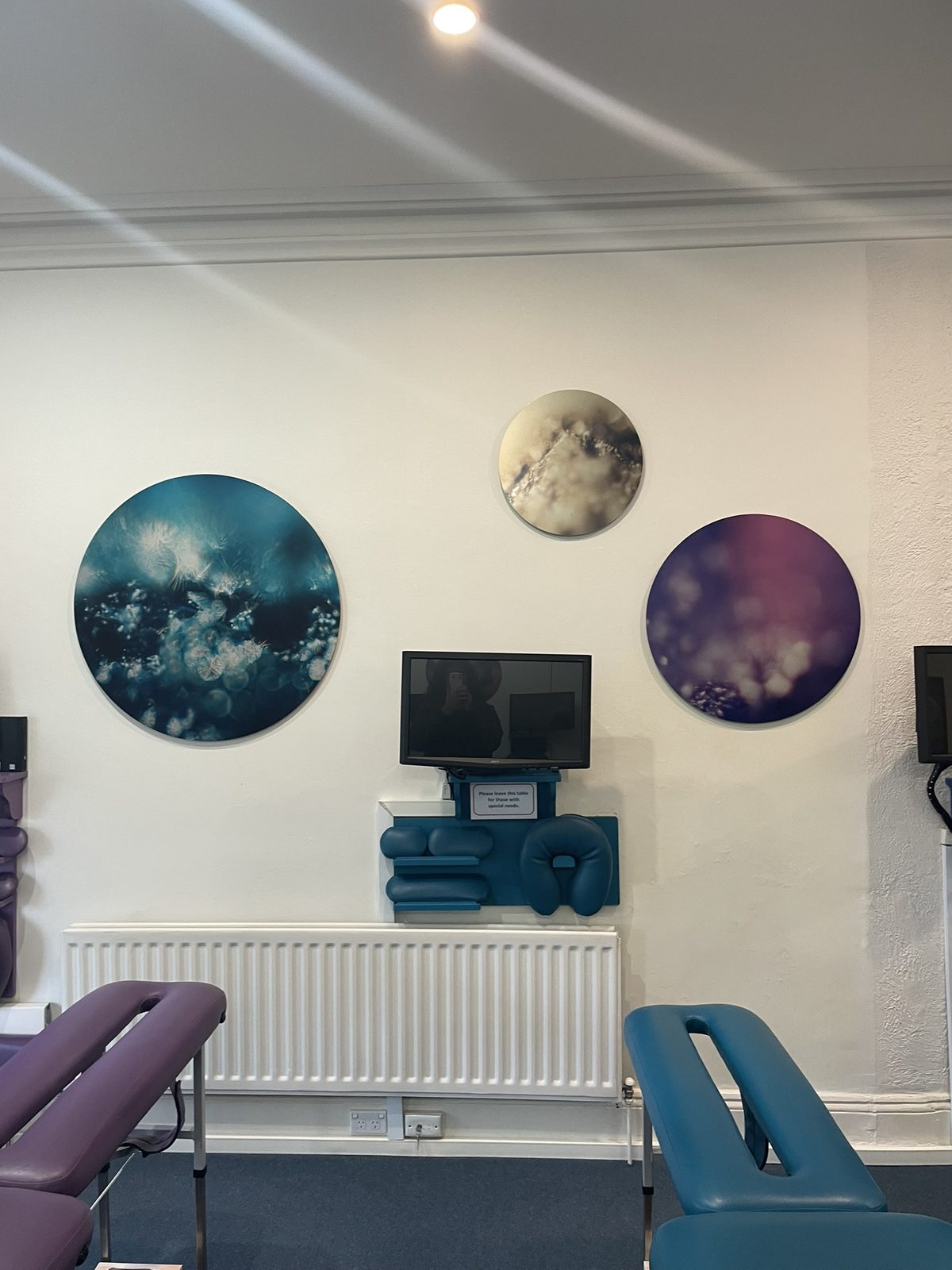 Two circular Keys to Awaken works above an adjusting table in the upstairs adjusting zone at the Diskin Life Centre, Fitzroy